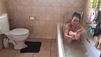 Play Fully tattooed young milf with small boobs bathing herself in the bathtub